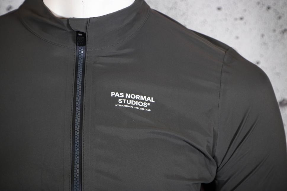 2025 Pas Normal Studios Men's Mechanism Shell Jacket - chest logo.jpg