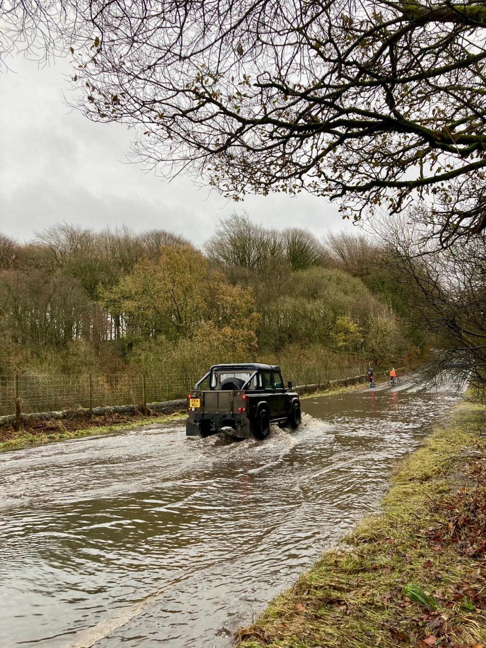 4x4 driver helps club cyclists across flooded section of road (Austin Kirkham, Facebook) 4