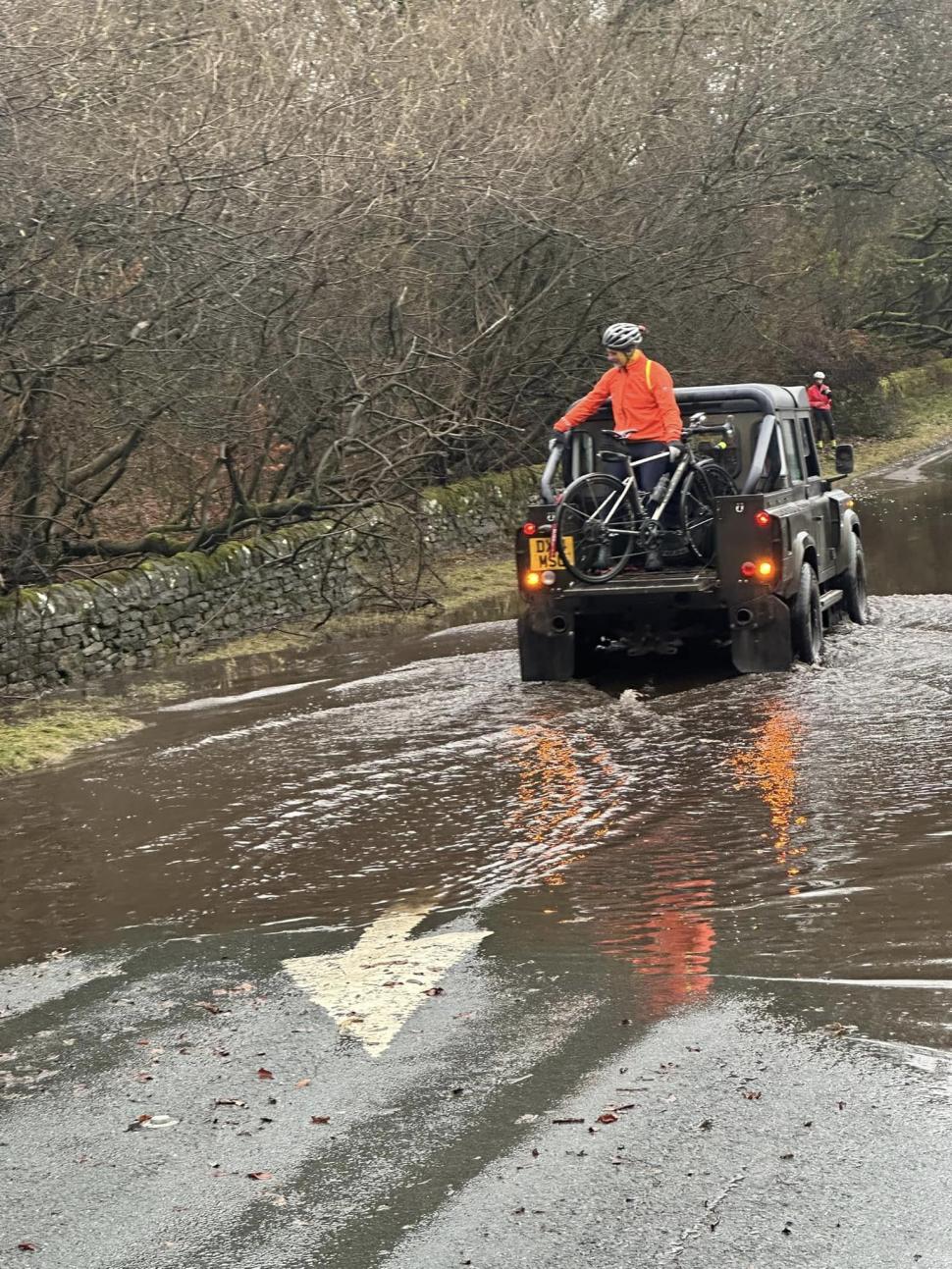 4x4 driver helps club cyclists across flooded section of road (Austin Kirkham, Facebook)