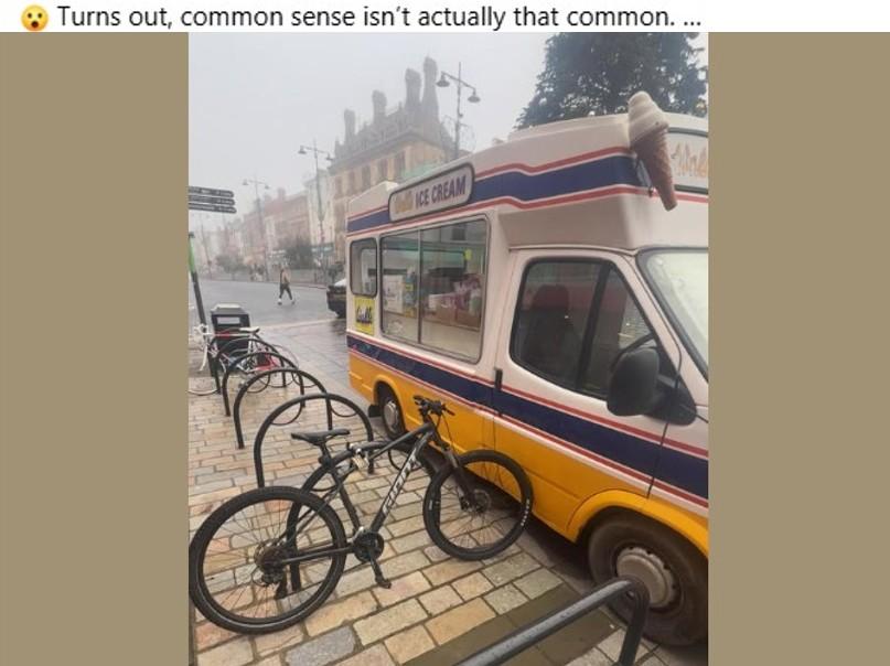 Bike parked on cycle rack blocks ice cream van door