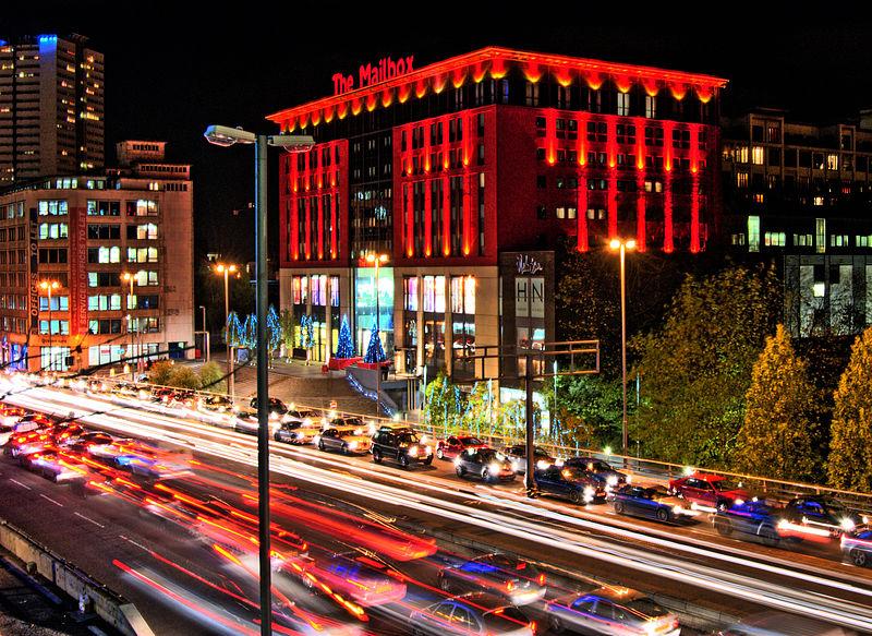 Birmingham Mailbox and traffic (licensed CC BY-SA 2.0 by Bs)u10e01 on Wikimedia Commons)
