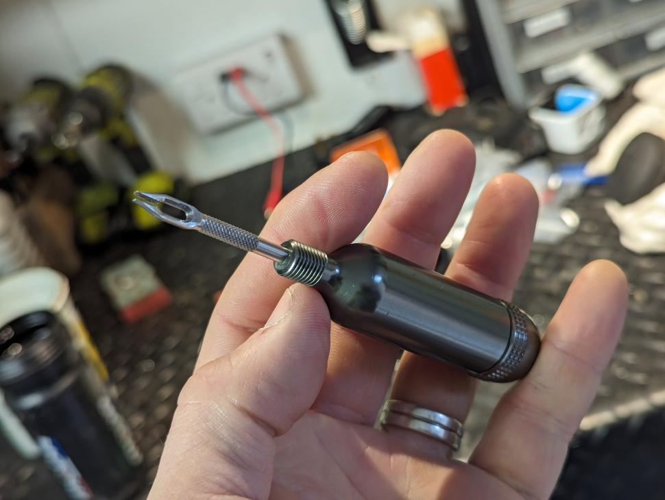 Birzman Tubeless Repair Tool in hand.jpg