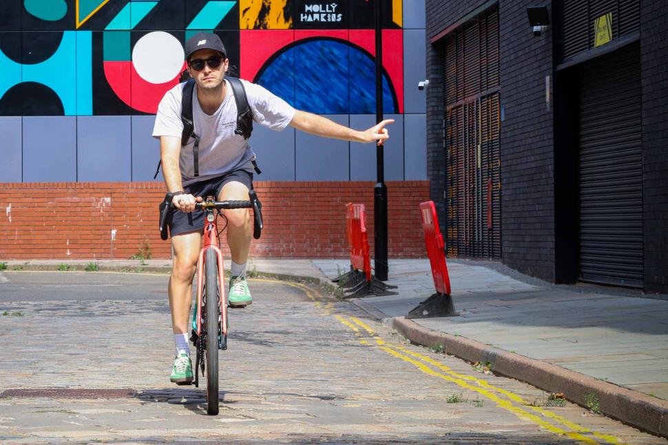 Commuting cyclist turning left 2.jpg