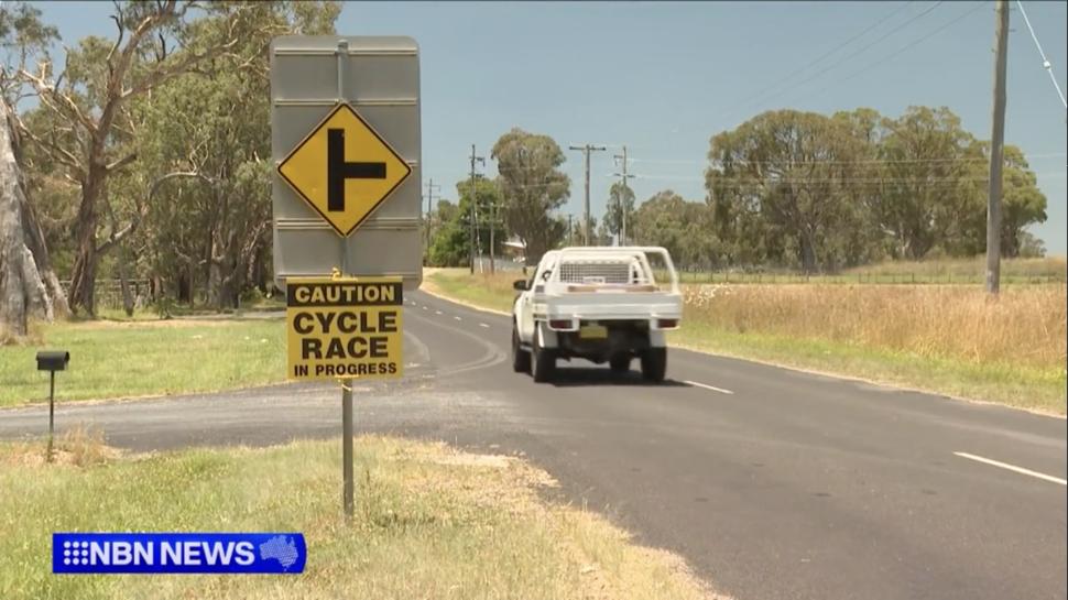 Cycle race in progress sign, Armidale, Australia (credit: NBN Television)