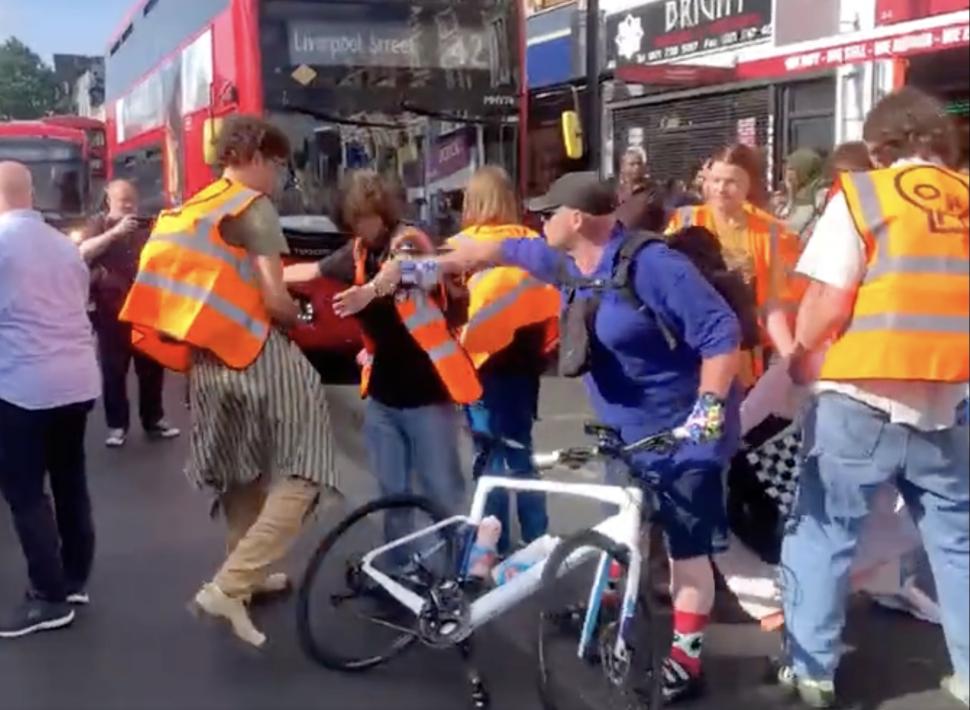 Cyclist disperses Just Stop Oil protest (Twitter)