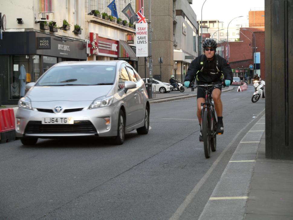 Cyclist in Hammersmith (copyright Simon MacMichael).JPG