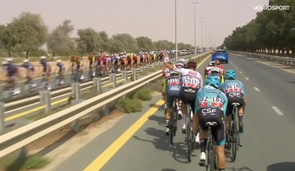 Domen Novak waves at the peloton from the breakaway (Eurosport)
