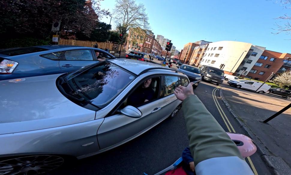 Driver blasts horn at cyclist and child as passenger tells him he “shouldn’t be in the middle of the bloody road”