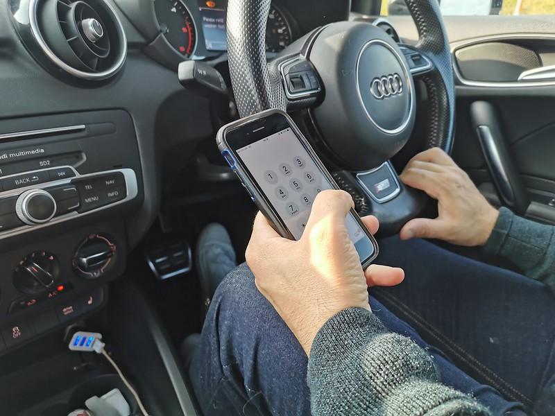 Driver using handheld mobile phone (image licensed CC BY 2.0 by DPP Law on Flickr)