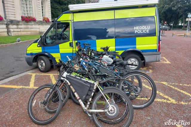 Seized e-bikes next to police car in Wales