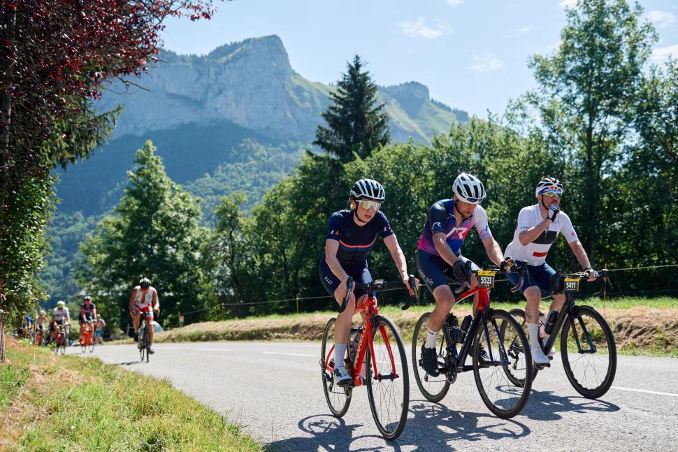 L'Étape du Tour cyclists ride a climb in the Alps