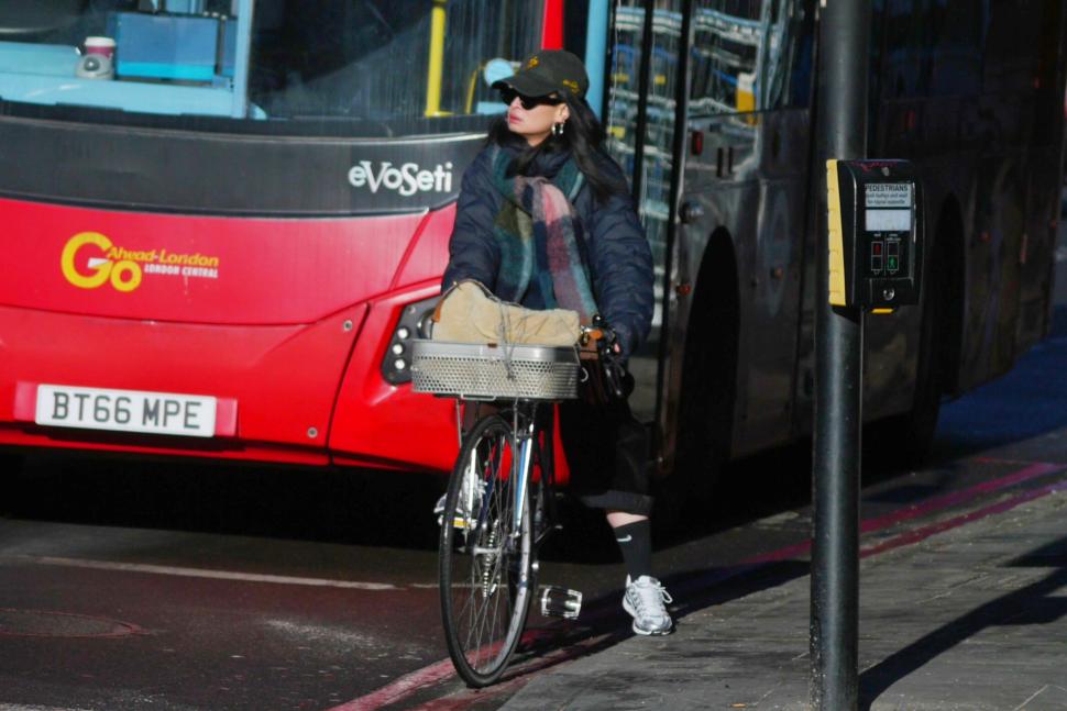 Female cyclist in London stopped with bus behind - copyright Simon MacMichael