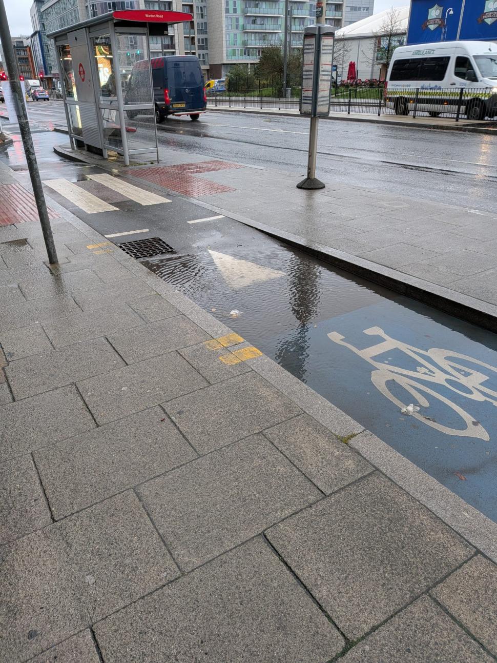 Flooded cycle lane, Warton Road, London
