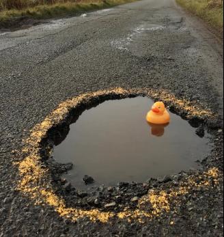 huge pothole - credit shaun wyllie on facebook.PNG