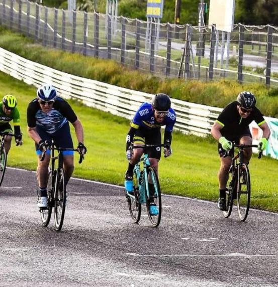 John Walsh (middle, in blue) sprinting during a race in Ireland