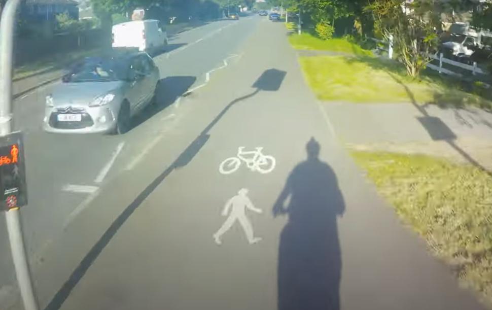 Motorist parked on shared cycle and pedestrian path tells cyclist to “get on the road” (Adrian Chapmanlaw, YouTube)