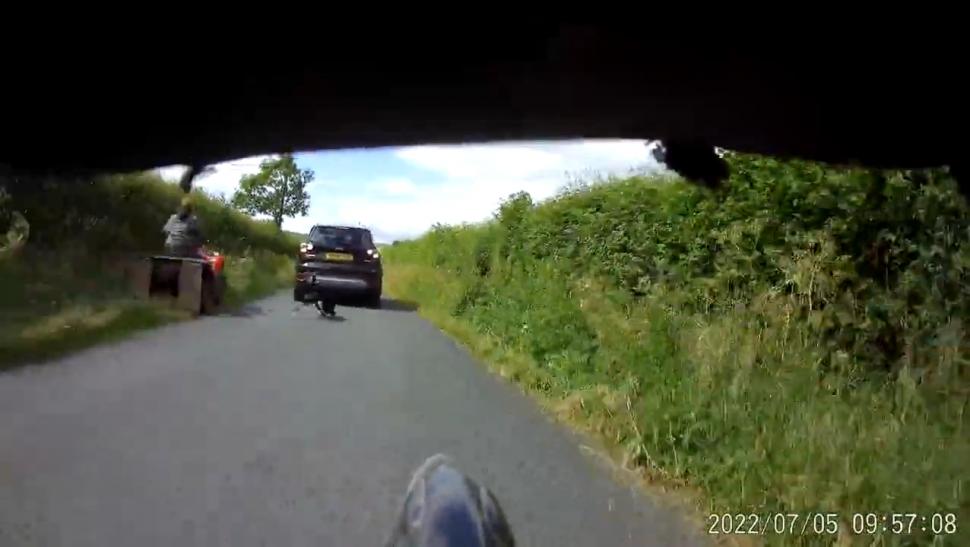 Near Miss of the Day 806_ Driver reverses at cyclist, runs over dog (rear view) 1-18 screenshot