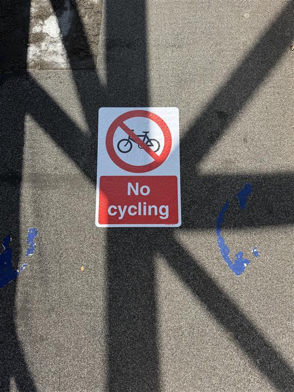 No No Cycling sign on Queensway footbridge