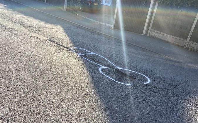 Pothole penis graffiti (Wendy McMahon)