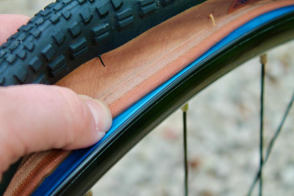 Pushing tyre bead into well - 1.jpeg