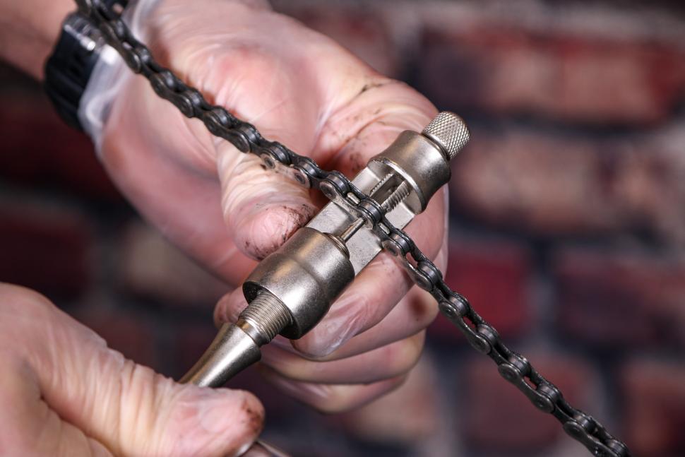 Replacing a bike chain - 12 - using a chain tool to remove a link.jpg