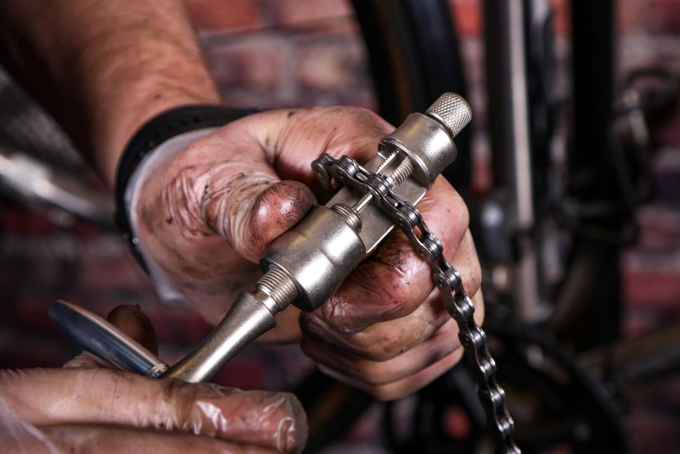 Replacing a bike chain - 19 - shortening new chain with chain tool.jpg