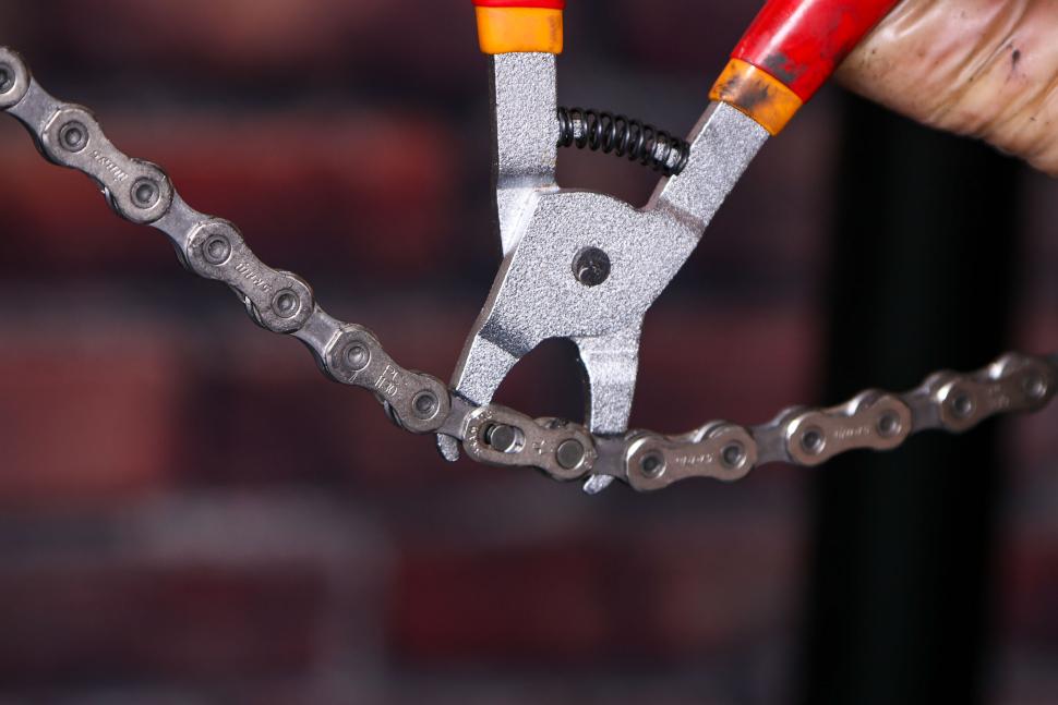 Replacing a bike chain - 24 - seating the magic link with pliers.jpg
