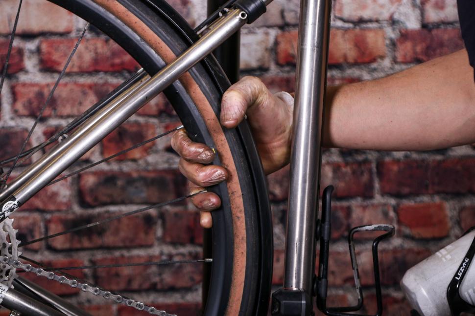 Replacing a bike chain - 27 - seating the magic link by pressure on pedals holding the rear wheel.jpg