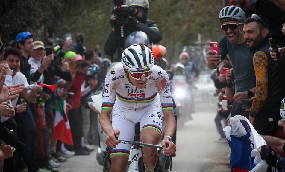 A bloodied Tadej Pogačar on his way to winning the 2025 Strade Bianche