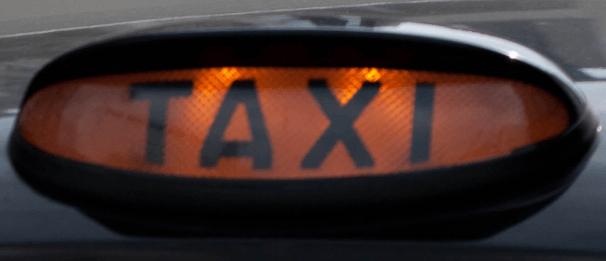 Taxi sign (licensed CC BT 2.0 by Ross Davidson on Flickr, image cropped).PNG