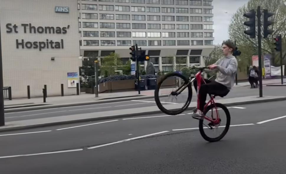 Teenager wheelieing through red light in London (NFBUK)
