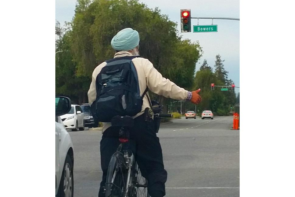 Turban wearing cyclist (licensed CC BY-SA 2.0 DEED on Flickr by Richard Masoner / Cyclelicious)