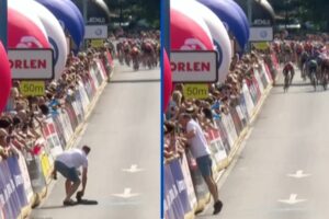 Tour of Poland “specator” collecting jumper from track