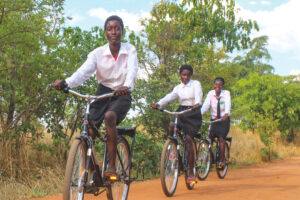 School children cycle to school in Africa