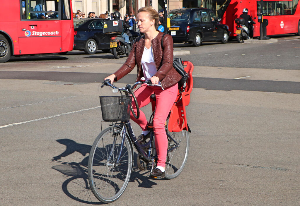 Woman on bike in London CC-BY-2.0 Waterford_Man via Flickr