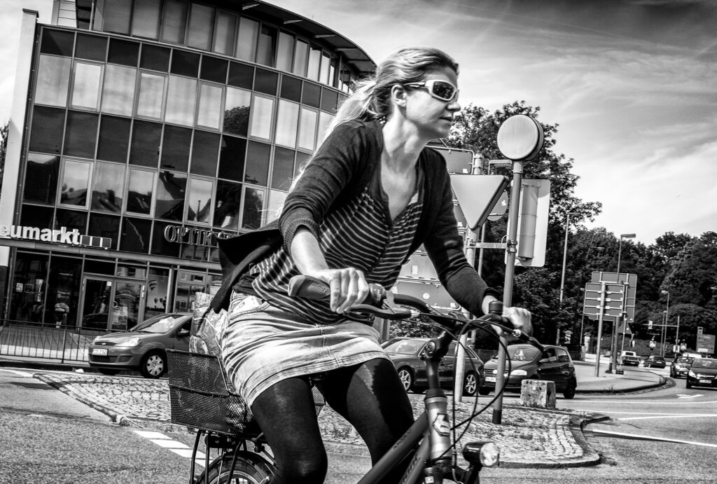 Woman on bike in normal clothes